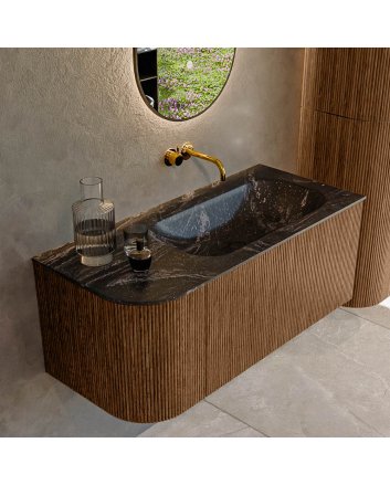Mondiaz Kurve-Dlux 105cm badmeubel ronding Links kleur Walnut met 1 lade en 1 deur. Wastafel Big small Rechts zonder kraangat Lava.
