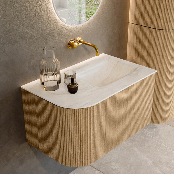 Mondiaz Kurve-Dlux 75cm badmeubel ronding Links kleur Oak met 1 lade en 1 deur. Wastafel Grunne Rechts zonder kraangat Ostra.